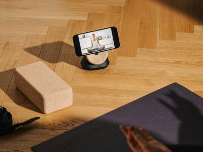 Yoga mat and a wooden block on the floor
